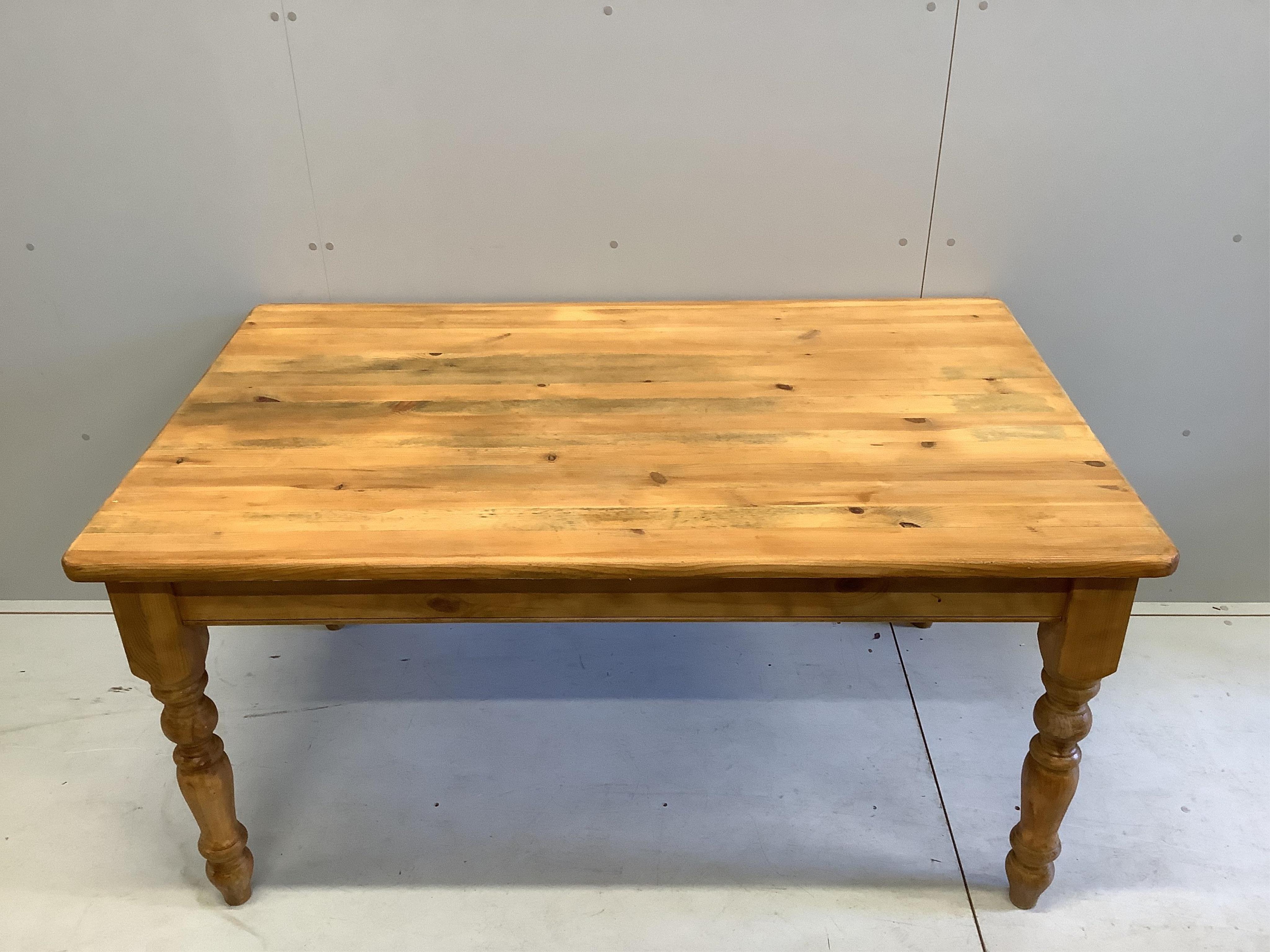 A modern pine kitchen table and four golden oak chairs, width 152cm, depth 93cm. Condition - some staining to the table top, wear and fading to the chairs